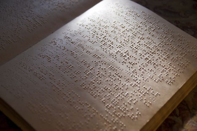 A book of Braille in shadows