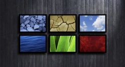 Some flat screens with environmental images on them