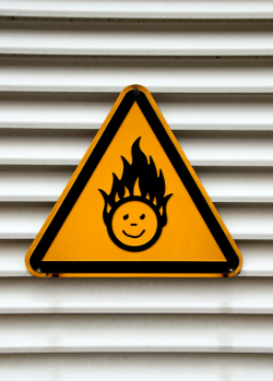 A sign with a flaming head