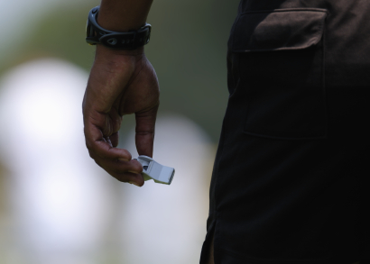 Referee holding whistle