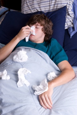 a teenager in bed with the flu