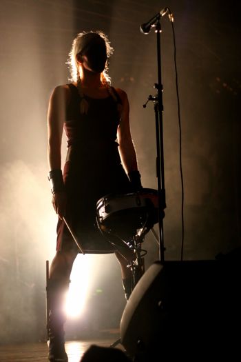 Female drummer standing