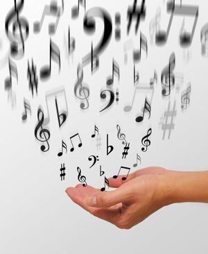 Musical notes in the hand. Copyright iStockPhoto ID 1614722