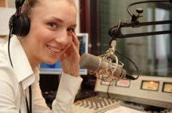 a young woman at a radio microphone