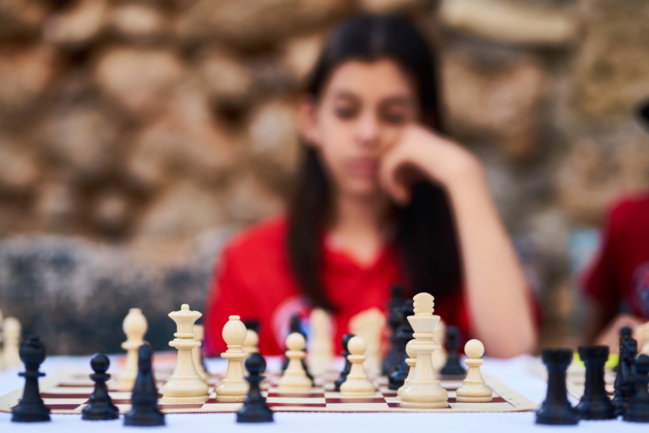 A girl playing chess