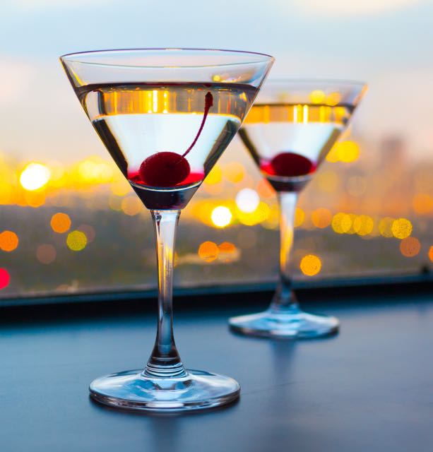 Cocktail glasses on a window sill