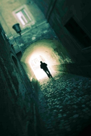 Man walking in dark street
