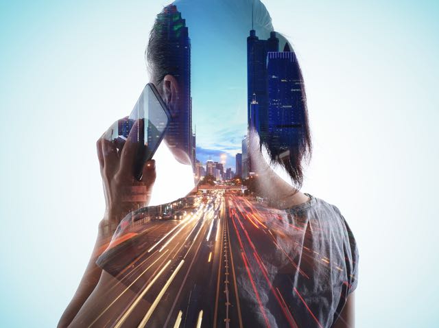 A woman with mobile phone and cityscape body