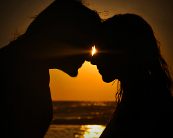 Two people leaning in for a kiss