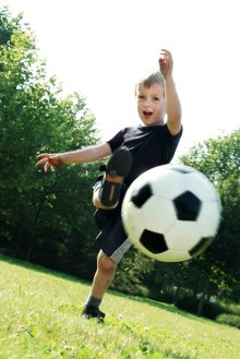 A boy practicing bending it like Beckham