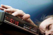 A man groping for the alarm
