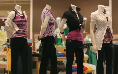 A row of manequins modelling women's clothes