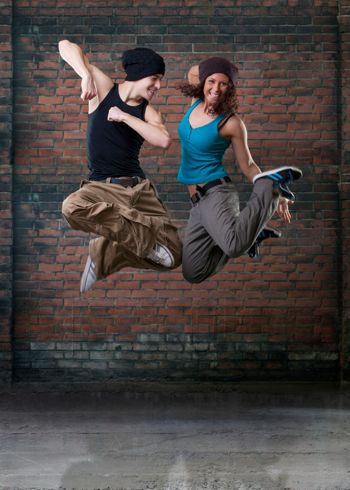 Two passion dancers jumping together: www.istock.com 21019031